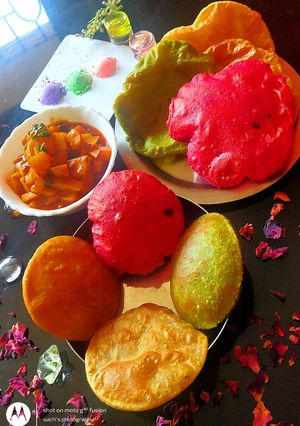 A picture of Colourful pooris.