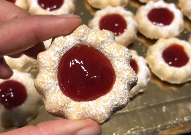 Voici la recette Sablés à la confiture extra fondant spécial