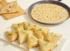 Une photo de Samoussas de crêpes salées aux champignons /jambon