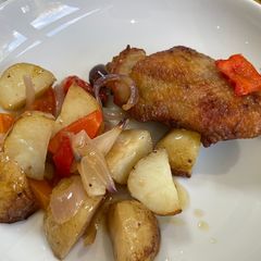 A picture of Chicken thighs with roasted veg and new potatoes.