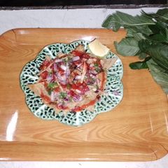 A picture of Nachos 🧅🍅🫑.