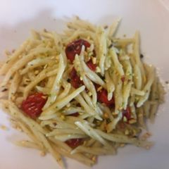 A picture of Pasta with pistachio pesto and roasted tomatoes.