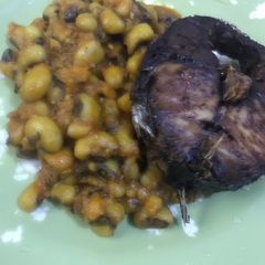 A picture of Beans and fried fish.