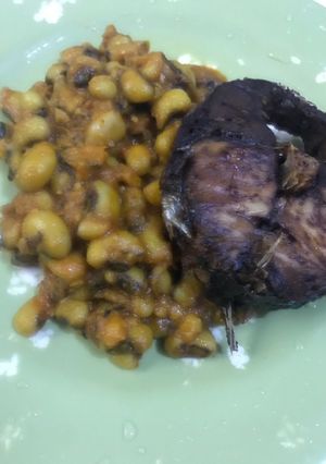 A picture of Beans and fried fish.