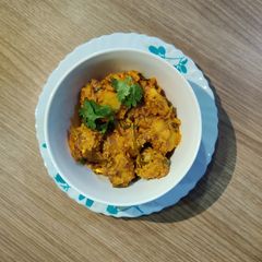 A picture of MASALA ARBI with COCONUT MILK.