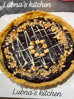 A picture of Nutella Tart with Toasted Hazelnut Crust:.