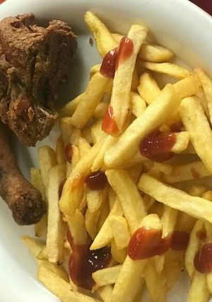 A picture of Chips and fried chicken.