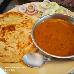A picture of Creamy daal with Laccha parantha.