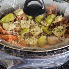 A picture of Three envelope slow cooked pork roast with veggies.