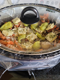 A picture of Three envelope slow cooked pork roast with veggies.
