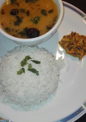 A picture of Moong Masoor Daal With White Rice and Mango Grated Achar.