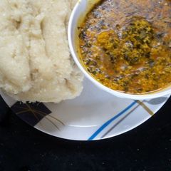 A picture of Egusi soup and Garri.