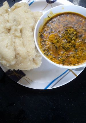 A picture of Egusi soup and Garri.
