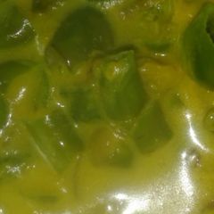 A picture of Green Chilli Sabzi with milk.