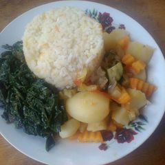 A picture of Carrot rice, fried kales and potato stew.