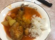 Una foto de pollo a la naranja con papa