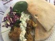 A picture of tzatziki and pita