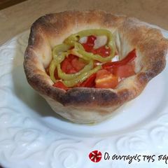 A picture of Bouyiourdi in a dough bowl alla Conna.