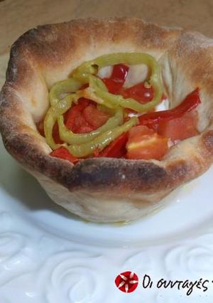A picture of Bouyiourdi in a dough bowl alla Conna.