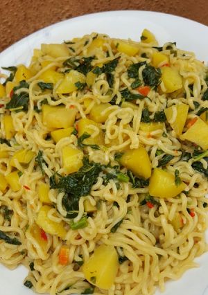 A picture of Noodles with irish & spinach.