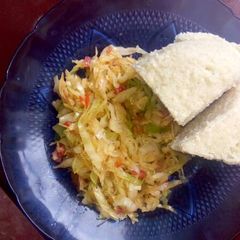 A picture of Fried cabbage and ugali.