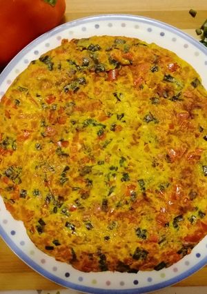 A picture of Frittata with Red Bell Peppers and Fresh Green Onions.