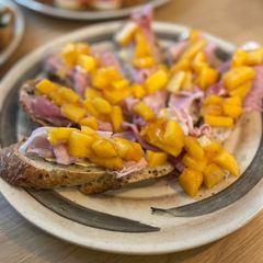 A picture of Kaki and ham on sliced baguette.