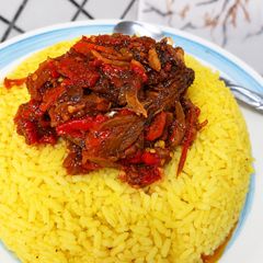 A picture of Turmeric Rice with Beef and Fish Stew.