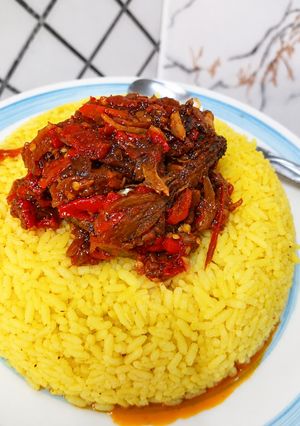 A picture of Turmeric Rice with Beef and Fish Stew.