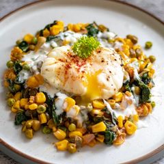A picture of Poached eggs with harissa mix tin vegetable.