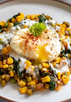 A picture of Poached eggs with harissa mix tin vegetable.
