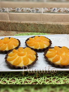 Una foto de Tartaletas al Cacao con Orange Curd y Mandarina 🍊