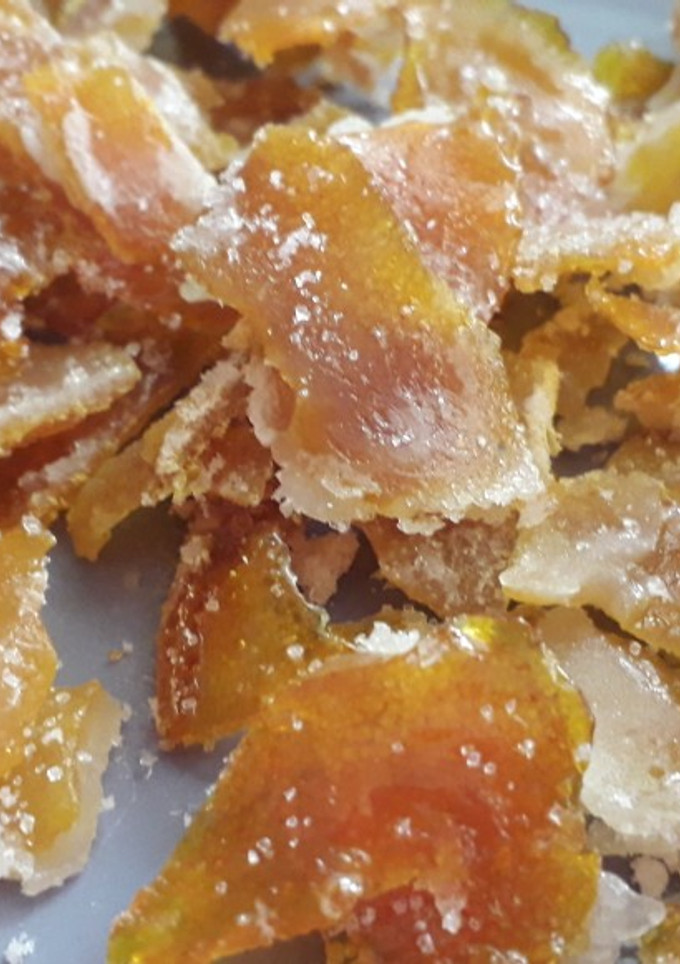 Una foto de Cascaritas de naranja confitadas 🍊