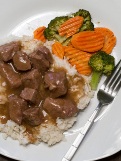 A picture of Beef Tips with Rice and Gravy.