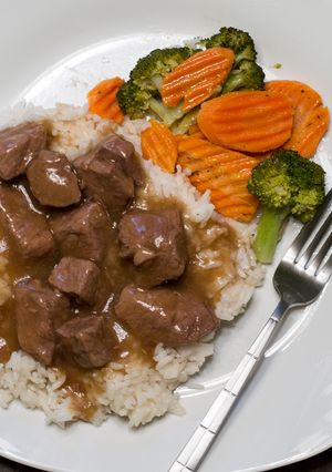 A picture of Beef Tips with Rice and Gravy.