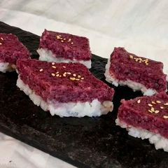 A picture of Purple Coconut sticky rice cake.