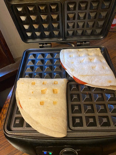 A picture of Hawaiian pizza waffle / pizza flip.