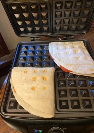 A picture of Hawaiian pizza waffle / pizza flip.