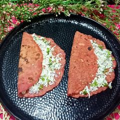 A picture of Rice Flour Beetroot Paratha Stuffed With Paneer Mixture.