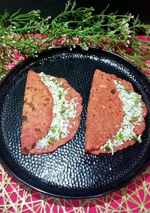 A picture of Rice Flour Beetroot Paratha Stuffed With Paneer Mixture.