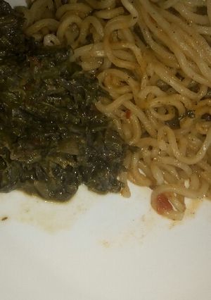 A picture of Beef noodles with mchicha.
