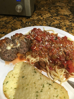 A picture of Scratch Spaghetti and Cheese Stuffed Meatballs .