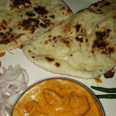 Butter naan in microwave oven A picture of Butter naan in microwave oven.