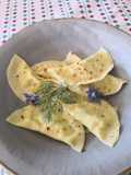 Ravioli with Ricotta, Borage, and Fennel Fronds in Brown Butter with Edible Flowers