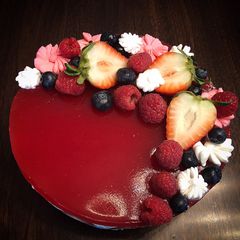 A picture of No Bake Cheesecake Strawberries Raspberries Mirror Glaze.