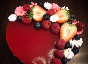 A picture of No Bake Cheesecake Strawberries Raspberries Mirror Glaze.