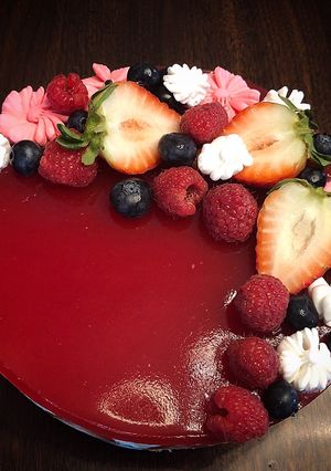 A picture of No Bake Cheesecake Strawberries Raspberries Mirror Glaze.