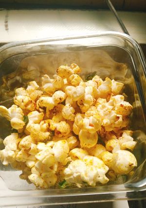 A picture of Cheesy masala popcorn.
