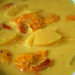 A picture of Prawn & Pineapple cooked in Coconut Sauce.