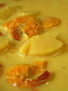 A picture of Prawn & Pineapple cooked in Coconut Sauce.